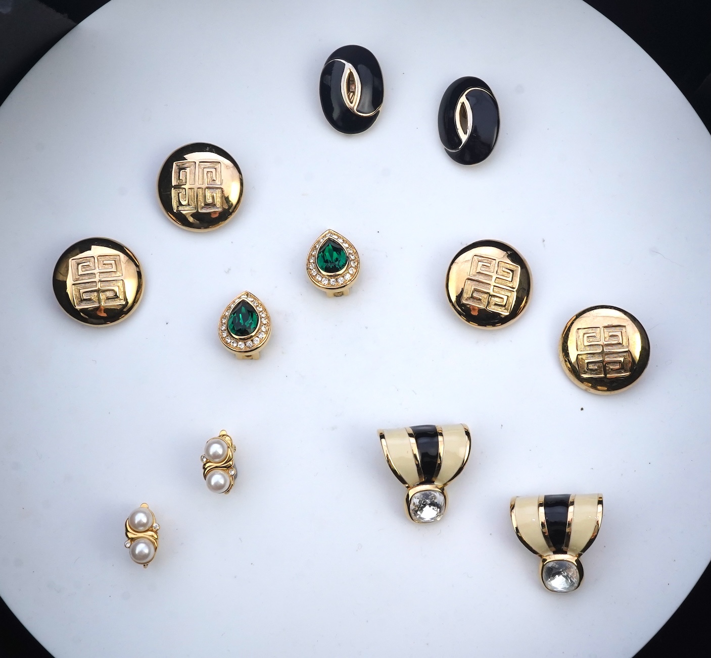 Two pairs of Givenchy clip earrings and four other pairs.